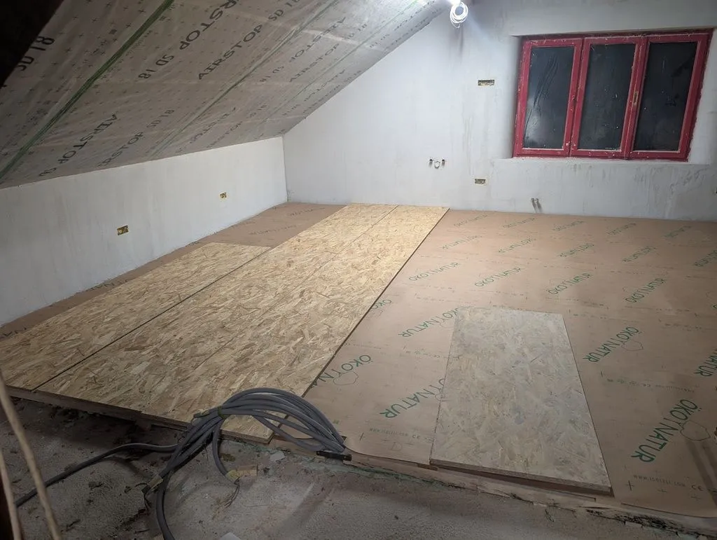 Test-fitting the first few subfloor boards.