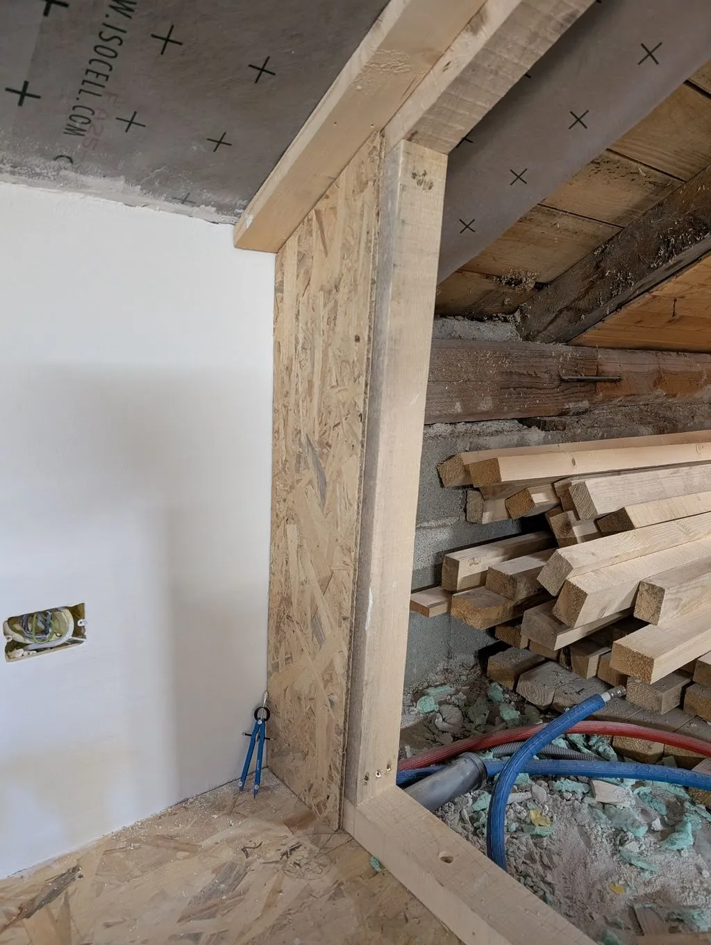 The first piece of sheathing going up on the main partition wall.