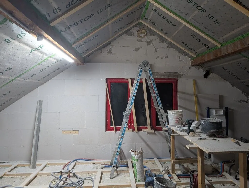 The first layer of Multipor blocks progressing up the wall.