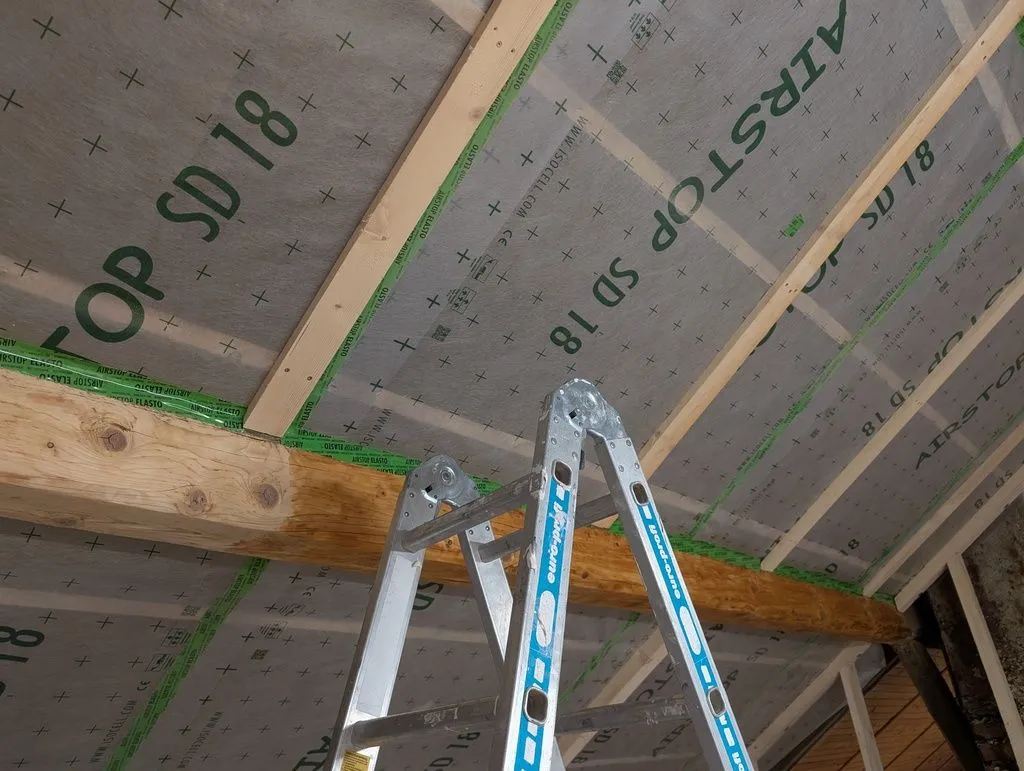 Most of the sanding was done on a ladder, so as to reach the beams.