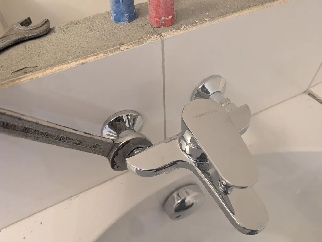 Installing the bathtub faucet.