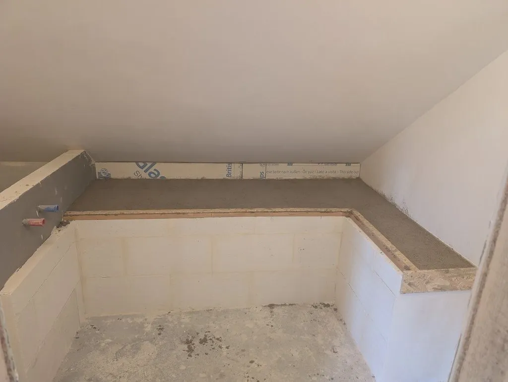 The completed screed, ready to receive tiles.