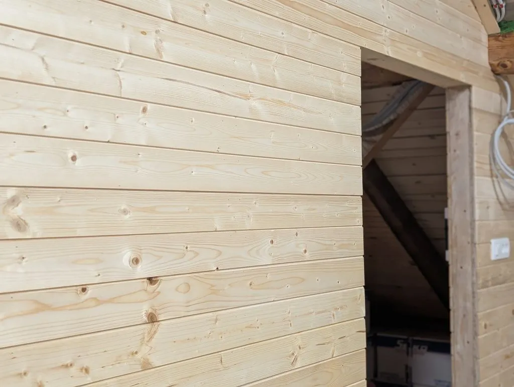 The completed tongue and groove finish on the interior wall.