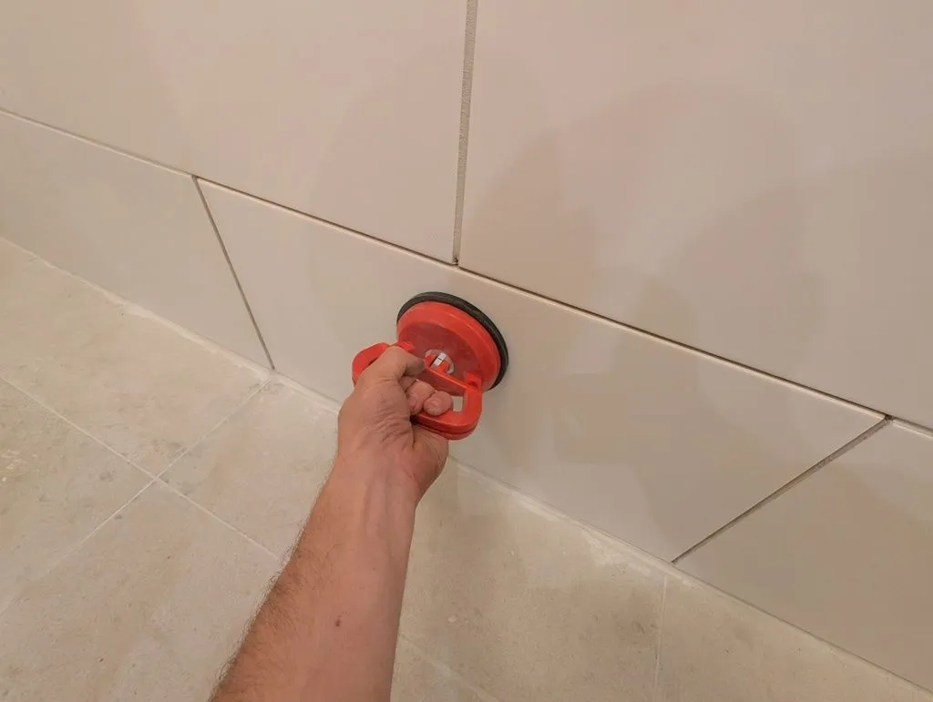 The blind tile is held in place magnetically...