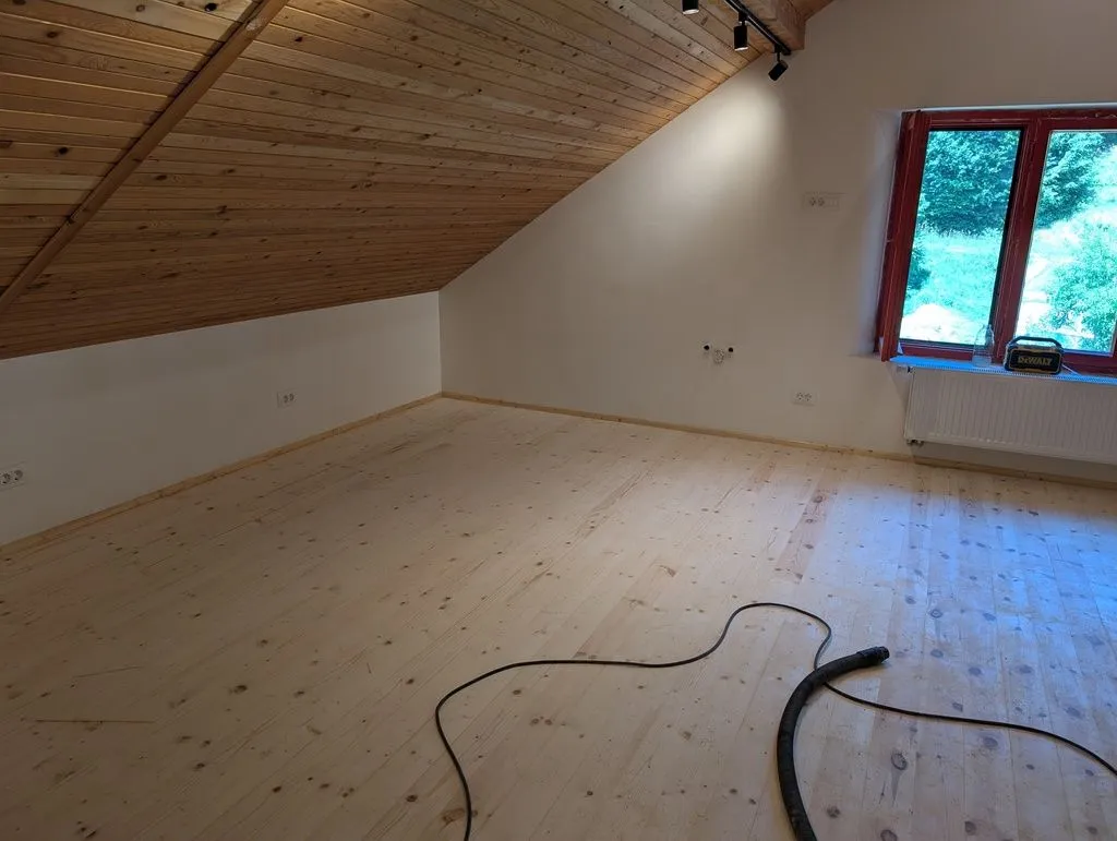 The completed baseboards in the far corner of the living area.