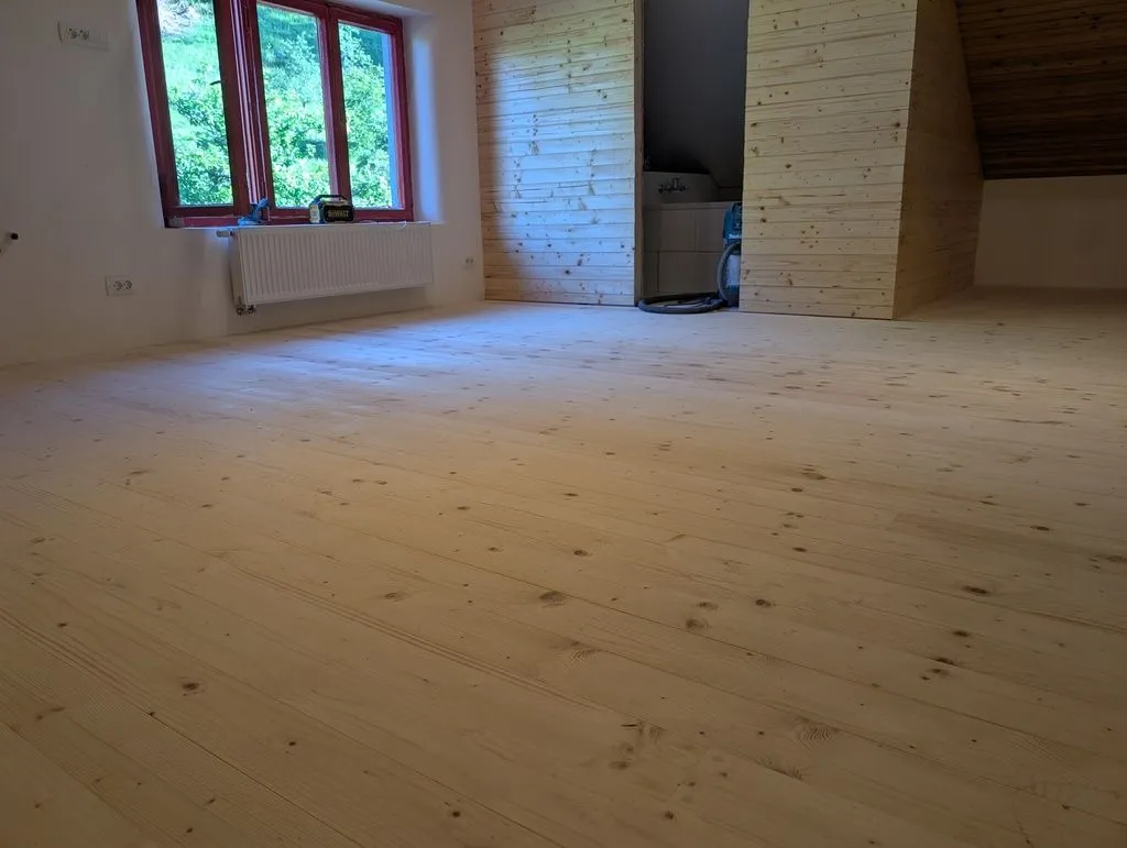 The completed finish floor installation after filling screw holes and sanding.