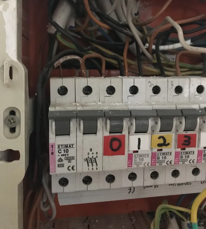 The three-phase main breaker in the original panel.