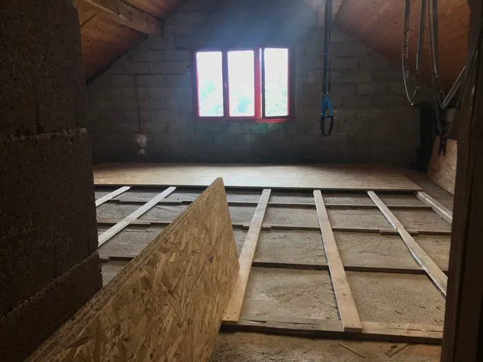 In the process of installing OSB panels over the sleeper grid.