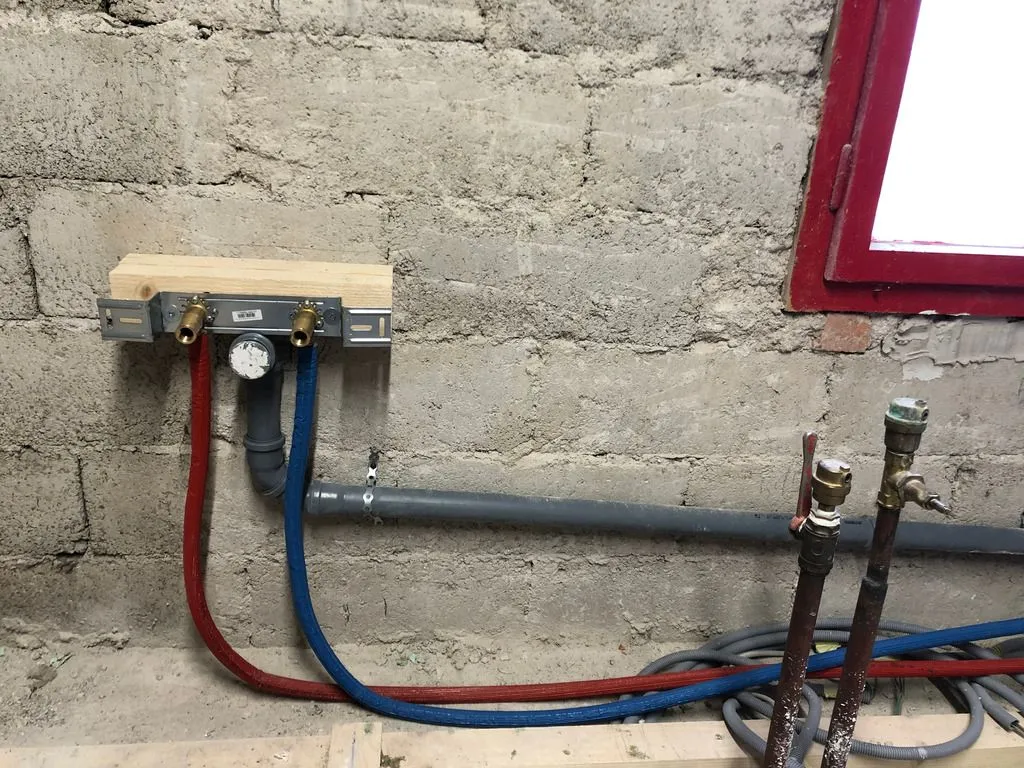 Drain and supply lines for a future kitchenette.