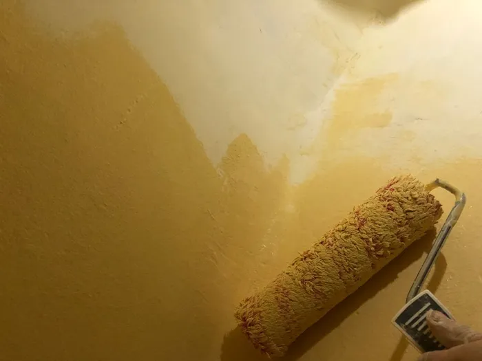 Rolling on the yellow paint for the accent region.