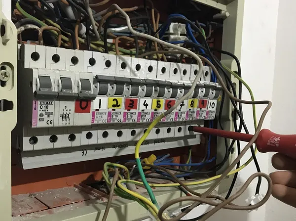 Beginning disassembly of the existing panel by removing the original live busbar.