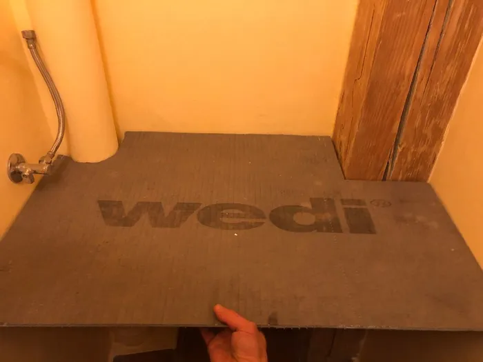 Template for desk fitting around timbers and drain pipes.