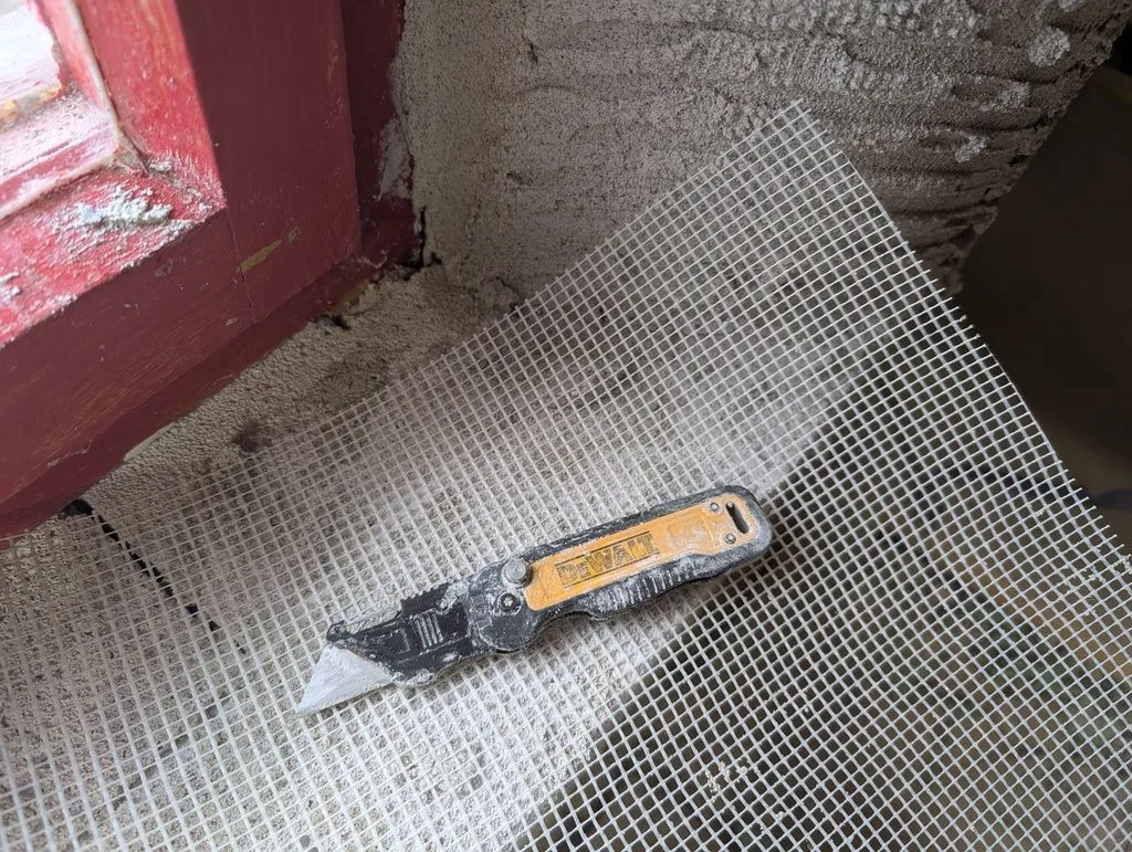 The fiberglass reinforcing mesh embedded in the base coat helps prevent cracking.
